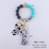 O1CN01NbVLwg1NrNdhaZHlH_2214899881623-0-cib Wholesale MAMA Wood Chips Cow Head Western Style Silicone Beads Wrist Keychain