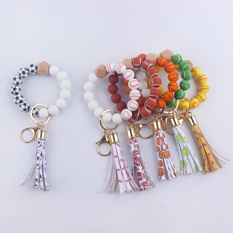 Wholesale New Silicone cartoon football beads bracelet wrist keychain PU leather tassel DIY bracelet key ring for women
