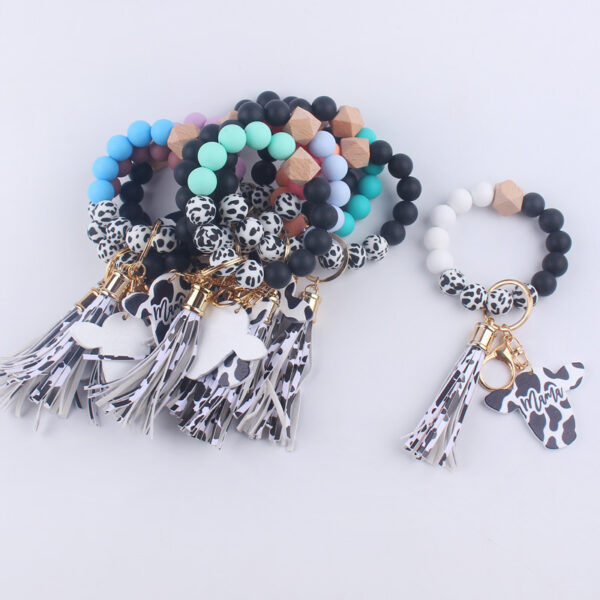 O1CN01NmKob41NrNditoJY3_2214899881623-0-cib Wholesale MAMA Wood Chips Cow Head Western Style Silicone Beads Wrist Keychain