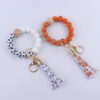 O1CN01NoYWeg1NrNe8Eg2Ar_2214899881623-0-cib-1 Wholesale Football Silicone Beaded Wrist Keychain