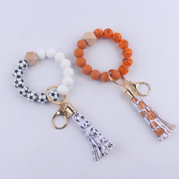 O1CN01NoYWeg1NrNe8Eg2Ar_2214899881623-0-cib-1 Wholesale Football Silicone Beaded Wrist Keychain