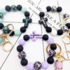 Wholesale Leopard Cross Silicone Beaded Tassel Wrist Keychain