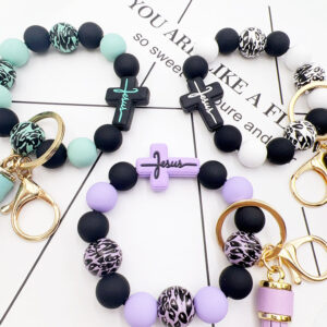 O1CN01Nxu2Cb1tKvJXAb19z__2207986825884-0-cib-3 Wholesale Leopard Cross Silicone Beaded Tassel Wrist Keychain