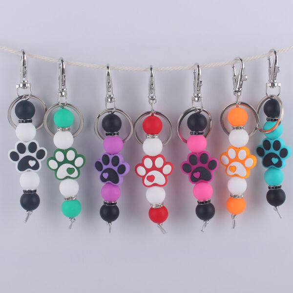 O1CN01OAjVO81NrNgM7mmdz_2214899881623-0-cib Wholesale Cartoon Dog Paw Silicone Handmade Beaded Keychain