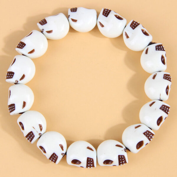 O1CN01OhZ0wr24CBVvSYw3T_2149317354-0-cib Wholesale Skull Beading Plastic Bracelet