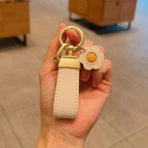 Beige keychain + sunflower with golden horseshoe buckle