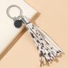 O1CN01Pt6na71bFjfKVfxTZ_2857743436-0-cib Wholesale PU Cow Pattern Tassel Keychain