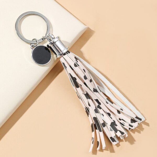 O1CN01Pt6na71bFjfKVfxTZ_2857743436-0-cib Wholesale PU Cow Pattern Tassel Keychain
