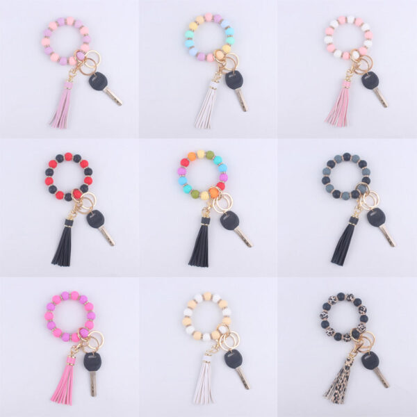 O1CN01QZIXt71NrNfKgSnK4__2214899881623-0-cib-1 Wholesale Silicone Beaded Tassel Wrist Keychain