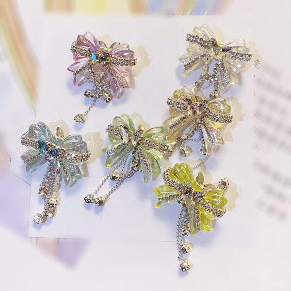 O1CN01QaL0am1R1rc9cR5Ud_2216318702052-0-cib-1 Wholesale Acrylic White Diamond Chain Bow Straight Hole Beads