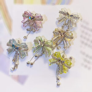 O1CN01QaL0am1R1rc9cR5Ud__2216318702052-0-cib-1 Wholesale Acrylic White Diamond Chain Bow Straight Hole Beads