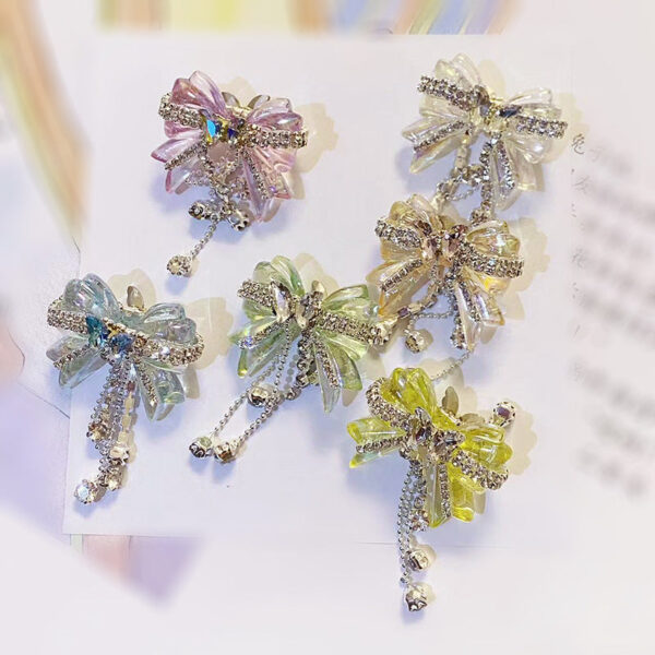 O1CN01QaL0am1R1rc9cR5Ud__2216318702052-0-cib-1 Wholesale Acrylic White Diamond Chain Bow Straight Hole Beads