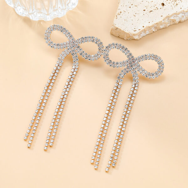 Wholesale Super Flash Claw Chain Bow Tassel Earrings