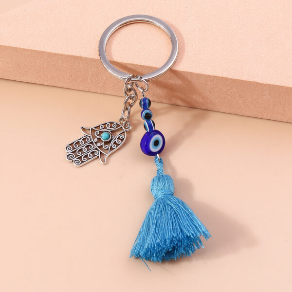 Wholesale Devil's Eye Hollow Palm Tassels Zinc Alloy Keychain