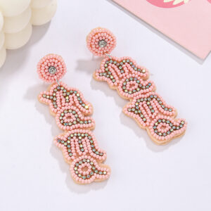 "a pair of pink english ""mama"" rice bead earrings"