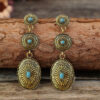Wholesale Retro Ethnic Style Golden Pumpkin Flower Inlaid Turquoise Long Alloy Earrings