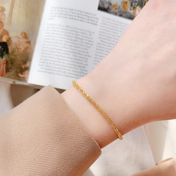 O1CN01S14nCV1mNwXKTraEi_2214535184943-0-cib Wholesale Sparkling Twist Chain Titanium Steel 18K Gold Bracelet