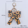 O1CN01S4k46X1NrNewD8wl7_2214899881623-0-cib Wholesale Cartoon Aztec Color Bow Leather Keychain