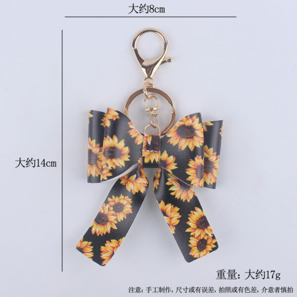 O1CN01S4k46X1NrNewD8wl7_2214899881623-0-cib Wholesale Cartoon Aztec Color Bow Leather Keychain