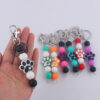 O1CN01SEH8ak1NrNgE3Df3F_2214899881623-0-cib Wholesale Cartoon Dog Paw Silicone Handmade Beaded Keychain