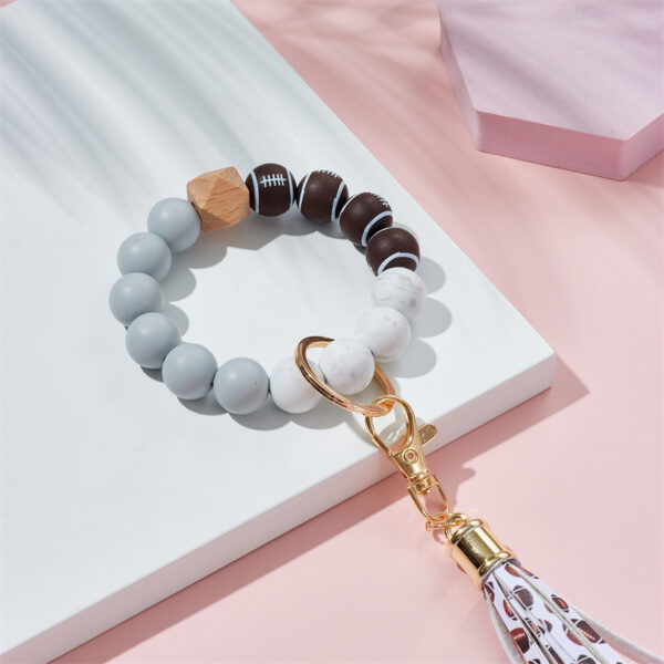 O1CN01SYOX0y2GBWJH6iCeF_2213317938977-0-cib-5 Wholesale basketball, football, rugby Silicone Beaded Wrist Keychain