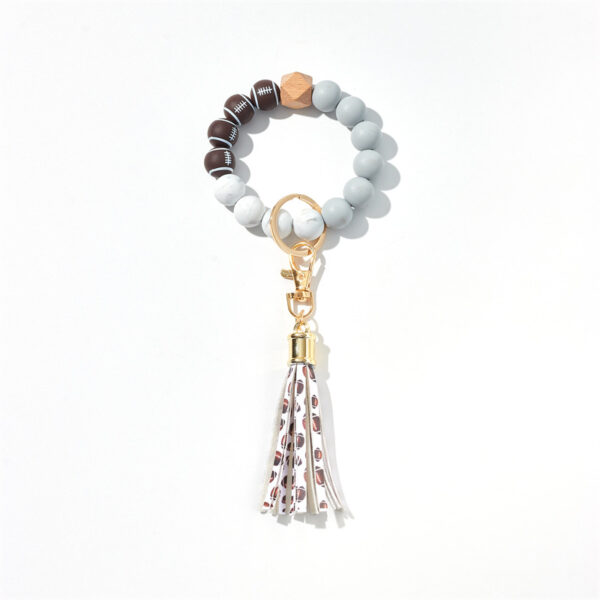 O1CN01SYt5QT2GBWJE8tzqD_2213317938977-0-cib-5 Wholesale basketball, football, rugby Silicone Beaded Wrist Keychain
