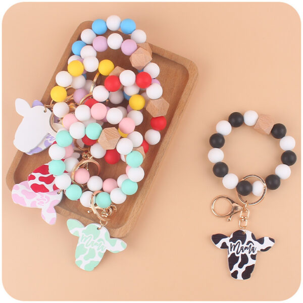 Wholesale Silicone Beads Cartoon Western Style Bull Head Wooden Sign Pendant Bracelet Keychains