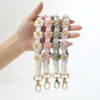 Wholesale Alloy Small Daisy Wristband Keychain