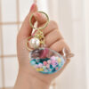 Wholesale Oil Bottle Floating Sugar Bean Whale Acrylic Liquid Keychain