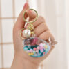 Wholesale Oil Bottle Floating Sugar Bean Whale Acrylic Liquid Keychain