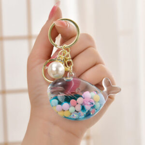 O1CN01T2hrzG1JM09f9cZgU__2200601031013-0-cib Wholesale Oil Bottle Floating Sugar Bean Whale Acrylic Liquid Keychain