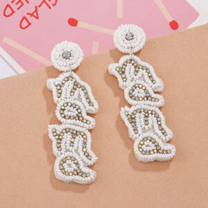 "a pair of white english ""mama"" rice bead earrings"