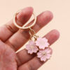 O1CN01TmIAoN2KzDhkR0hnA_2211051639627-0-cib Wholesale Cherry Blossom Metal Keychain Handbag Decoration Pendant Accessories