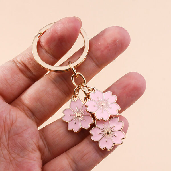 O1CN01TmIAoN2KzDhkR0hnA_2211051639627-0-cib Wholesale Cherry Blossom Metal Keychain Handbag Decoration Pendant Accessories