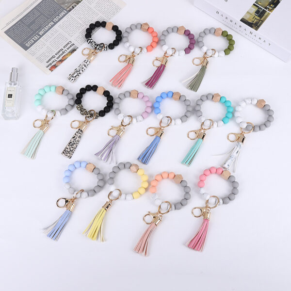 O1CN01UCx2TD1FT5ZRq4lyY_2698260487-0-cib-1 Wholesale Tassel Wood Beads Silicone Keychains