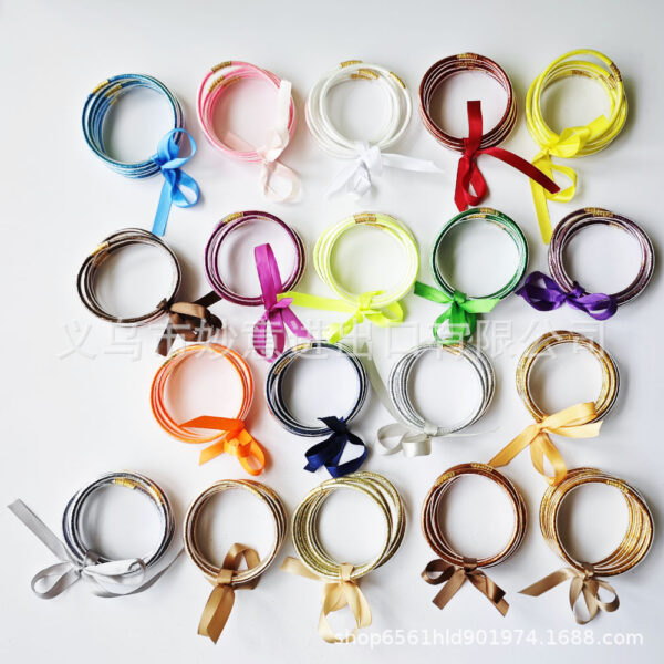 O1CN01V3mgm42E5RveLAAha_2210959578693-0-cib-1 Wholesale Silicone Women's Bow Gold Powder Bracelet