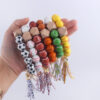 O1CN01V4Rjse1NrNeBtSTZA_2214899881623-0-cib-1 Wholesale Football Silicone Beaded Wrist Keychain