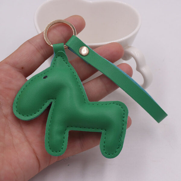 O1CN01VDUXPh2KfWg9CVBVG_2816159584-0-cib Wholesale of Green Pony PU Leather Keychains