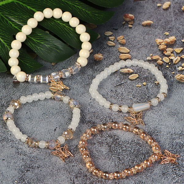Wholesale Four Layer Butterfly Pendant Glass Elastic Bracelet