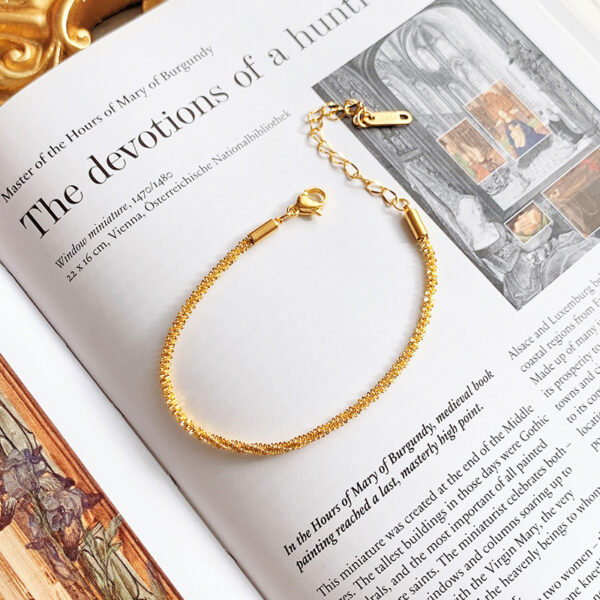 O1CN01VkQuz41mNwXEPil1h_2214535184943-0-cib Wholesale Sparkling Twist Chain Titanium Steel 18K Gold Bracelet