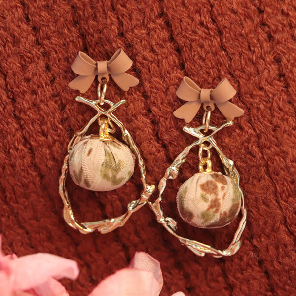 Wholesale Bow Hollow Alloy Earrings