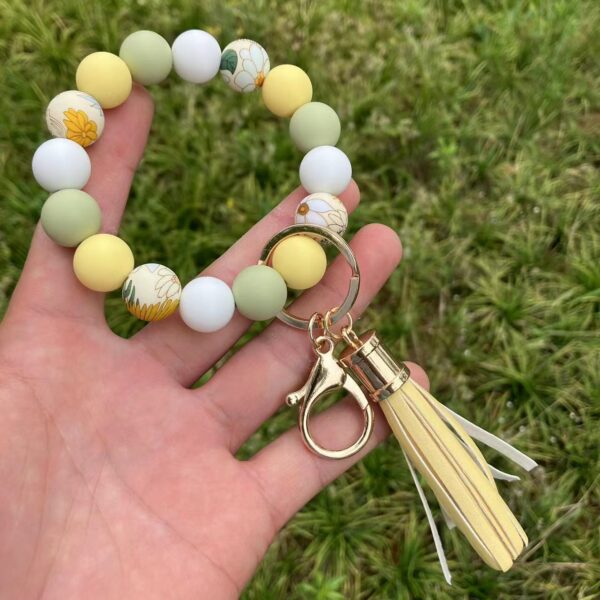 O1CN01WSnxoV1FT5dewGKXL_2698260487-0-cib-1 Wholesale Leopard Sunflower Tassel Silicone Beaded Wrist Keychain