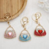Wholesale Zinc Alloy Rhinestone Lipstick Perfume Bottle Keychain