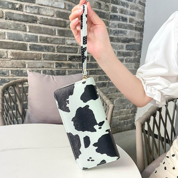 O1CN01XDNw9v1Oh8FibSEZg_3524471736-0-cib Wholesale PU Contrasting Cow Pattern Multi Compartment Wallet Long Horizontal Carrying Bag