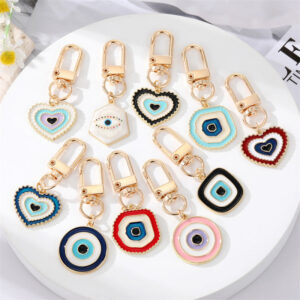 O1CN01YMZgNK215p4Mj9zkD__4097876934-0-cib Wholesale Irregular Devil's Eye Metal Keychains