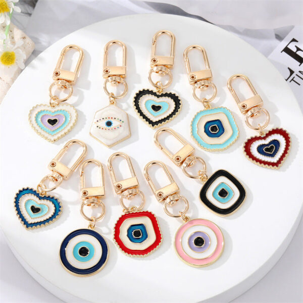 O1CN01YMZgNK215p4Mj9zkD__4097876934-0-cib Wholesale Irregular Devil's Eye Metal Keychains