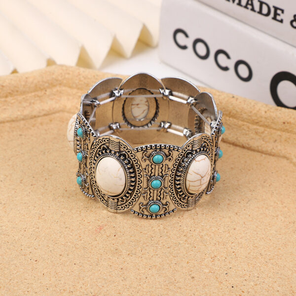 O1CN01YoSq5H1jhgnbB5UAG_2215436944580-0-cib Wholesale Hollow Inlaid Turquoise Alloy Bracelet