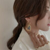 O1CN01aKErEd1yaYrHRcMxO_2215209296595-0-cib Wholesale Alloy Heart-shaped Long Earrings
