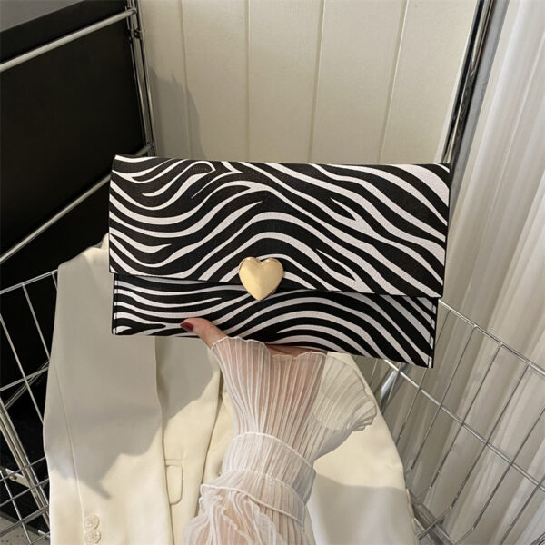 O1CN01bpmMoT1X6L9CCFA3P_2209708732874-0-cib Wholesale Cow Pattern Clutch Envelope Document Bag