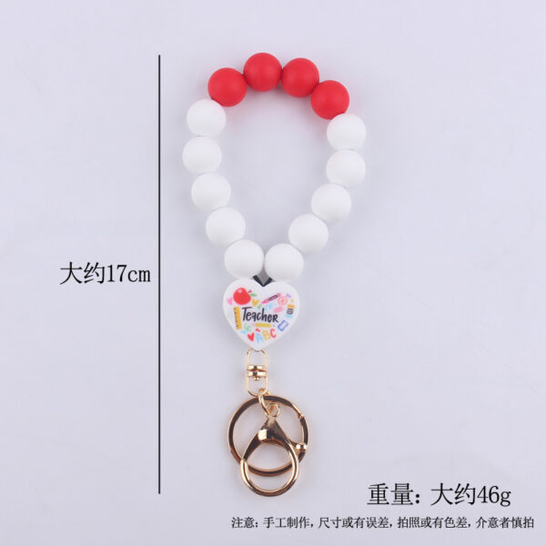 O1CN01cOWkhs1NrNiA07u40_2214899881623-0-cib Wholesale Cartoon Love Printed Silicone Beaded Wrist Keychain